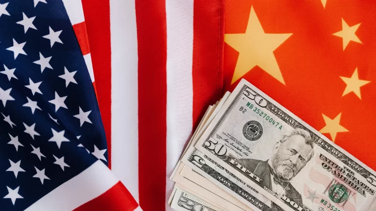 Debt, Demographics, and De-dollarization