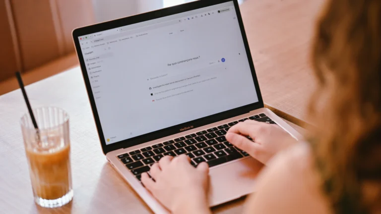Freelancer working on a laptop, representing an AI-assisted one-person operating system